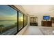 Bedroom with sunset views and built-in dresser at 4557 Bay Club Dr, Bradenton, FL 34210