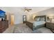 Primary bedroom with large dresser and ensuite bath at 4557 Bay Club Dr, Bradenton, FL 34210