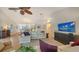 Spacious living area featuring a large TV and comfortable seating at 4557 Bay Club Dr, Bradenton, FL 34210