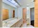 Bright bathroom with double sinks, and a walk-in shower at 5604 Garden Lakes Dr, Bradenton, FL 34203