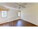 Spacious bedroom with wood-look flooring and dual windows at 5604 Garden Lakes Dr, Bradenton, FL 34203