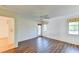 Bright bedroom with wood-look flooring and patio access at 5604 Garden Lakes Dr, Bradenton, FL 34203