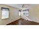 Spacious bedroom with wood-look flooring and dual windows at 5604 Garden Lakes Dr, Bradenton, FL 34203