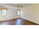 Spacious bedroom with wood-look flooring and dual windows at 5604 Garden Lakes Dr, Bradenton, FL 34203