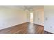 Spacious bedroom with wood-look flooring and ensuite bath at 5604 Garden Lakes Dr, Bradenton, FL 34203