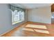 Living room features wood floors and a bay window at 5604 Garden Lakes Dr, Bradenton, FL 34203