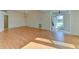 Spacious living area with wood floors and lots of natural light at 5604 Garden Lakes Dr, Bradenton, FL 34203