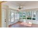 Sunroom with tile floors, ceiling fan, and garden views at 5604 Garden Lakes Dr, Bradenton, FL 34203