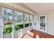 Sunroom with tile floors, ceiling fan, and garden views at 5604 Garden Lakes Dr, Bradenton, FL 34203