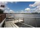 Community boat dock with small aluminum boat at 6503 Moorings Point Cir # 202, Lakewood Ranch, FL 34202