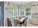 Bright dining area with built-in bench seating and lake view at 6503 Moorings Point Cir # 202, Lakewood Ranch, FL 34202