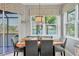 Kitchen dining area with a wooden table and lake view at 6503 Moorings Point Cir # 202, Lakewood Ranch, FL 34202