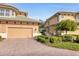 Two-car garage with brick paver driveway at 6503 Moorings Point Cir # 202, Lakewood Ranch, FL 34202