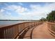 Scenic lakeside walkway with wooden railings at 6503 Moorings Point Cir # 202, Lakewood Ranch, FL 34202