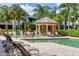 Resort-style pool with multiple lounge chairs and a shaded gazebo at 6503 Moorings Point Cir # 202, Lakewood Ranch, FL 34202