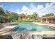 Relaxing pool area with plenty of lounge chairs at 6503 Moorings Point Cir # 202, Lakewood Ranch, FL 34202