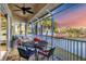 Relaxing screened balcony overlooking a lake with sunset views at 6503 Moorings Point Cir # 202, Lakewood Ranch, FL 34202