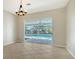 Bright dining room with view of the pool at 8186 Shadow Pine Way, Sarasota, FL 34238