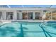 Relaxing pool with patio and covered lanai at 8186 Shadow Pine Way, Sarasota, FL 34238