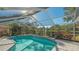 Screened pool area with lake view at 8186 Shadow Pine Way, Sarasota, FL 34238