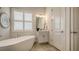 Relaxing bathroom with soaking tub and modern vanity at 16026 39Th E Gln, Parrish, FL 34219