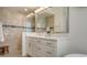 Modern bathroom with shower, vanity, and large mirror at 16026 39Th E Gln, Parrish, FL 34219