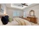 Bright bedroom with wood furniture and a ceiling fan at 16026 39Th E Gln, Parrish, FL 34219