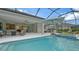 Relaxing pool area with spa, outdoor kitchen, and covered patio at 16026 39Th E Gln, Parrish, FL 34219