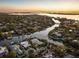 Aerial view of waterfront home with private dock and lush landscaping at 1718 Bay St, Sarasota, FL 34236