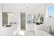 Spa-like bathroom featuring a freestanding tub and dual vanities at 1718 Bay St, Sarasota, FL 34236