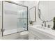 Modern bathroom with a glass shower, white subway tile, and updated vanity at 1718 Bay St, Sarasota, FL 34236