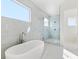 Modern bathroom with a freestanding tub and a large shower at 1718 Bay St, Sarasota, FL 34236