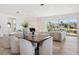 Elegant dining room with large windows and modern furnishings at 1718 Bay St, Sarasota, FL 34236