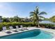 Inviting swimming pool with lounge chairs, overlooking a tranquil canal at 1718 Bay St, Sarasota, FL 34236