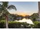 Scenic sunset view over calm water with boats and lush foliage at 1718 Bay St, Sarasota, FL 34236