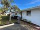 Side view of a single story home with landscaping at 1741 Caribbean Cir # 13, Venice, FL 34293