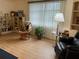 Relaxing living room with comfy seating, built-in shelving, and large window at 1741 Caribbean Cir # 13, Venice, FL 34293