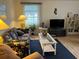 Bright living room with tile floors and comfy furniture at 1741 Caribbean Cir # 13, Venice, FL 34293