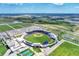 Aerial view of baseball stadium with surrounding fields and parking at 20717 Benissimo Dr, Venice, FL 34293