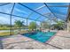 Inviting pool area with screened enclosure, pavers, and tranquil water views at 20717 Benissimo Dr, Venice, FL 34293