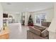 Spacious living room with comfortable seating and a Christmas tree at 3284 Silver Date Dr, Wimauma, FL 33598