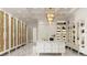 Large walk-in closet with ample storage and custom shelving at 3990 Higel Ave, Sarasota, FL 34242