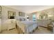 Bright bedroom with a queen-size bed and dresser at 4410 Weybridge # 91, Sarasota, FL 34235