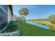 Backyard with canal and golf course view at 4410 Weybridge # 91, Sarasota, FL 34235