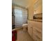 Bathroom with updated vanity, tile flooring, and shower at 4951 Bell Meade Dr, Sarasota, FL 34232