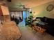 Living room with tile flooring and access to the kitchen at 4951 Bell Meade Dr, Sarasota, FL 34232