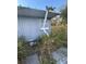 Damaged shed with overgrown weeds at 4951 Bell Meade Dr, Sarasota, FL 34232