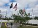 Flags and landscaping at Palm Lake Estates at 5414 Burma Ct, Bradenton, FL 34207