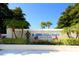 IMG Academy entrance; stone wall with signage, statue, lush landscaping, and palm trees at 7812 20Th W Pl, Bradenton, FL 34209