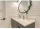 Powder room features a floating vanity and a sleek vessel sink at 7904 20Th W Pl, Bradenton, FL 34209